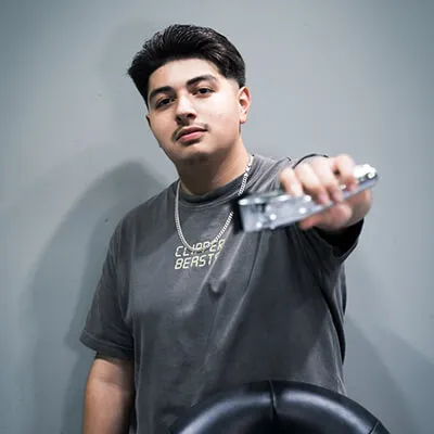 Cris Clipz, barber at Blades Vision Barbershop in Houston